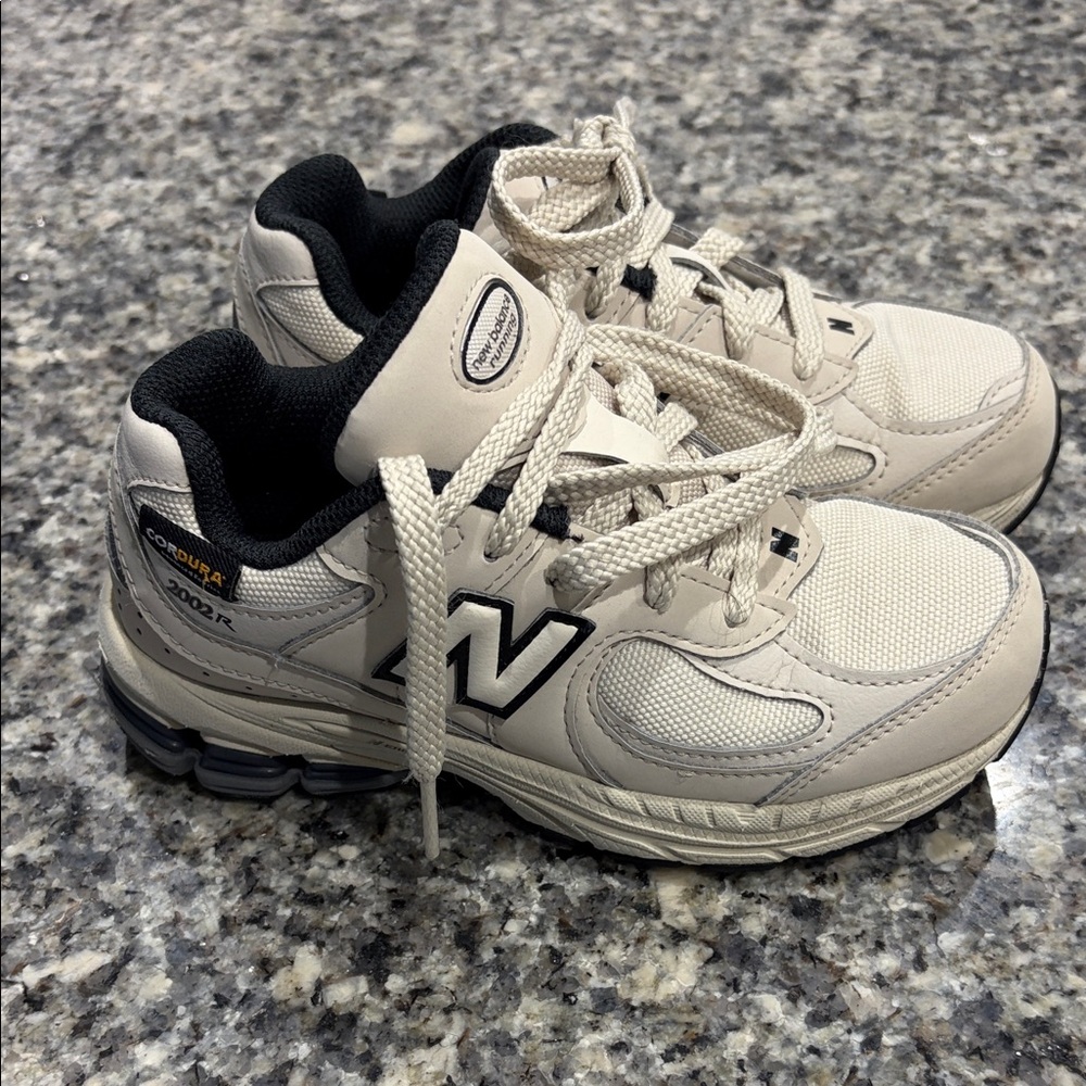 Kids New Balance Cream and Black Athletic Shoes